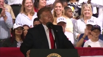 Trump laughs after audience member suggests shooting migrants