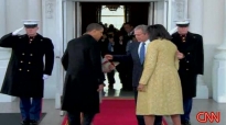 Bushes greet Obamas